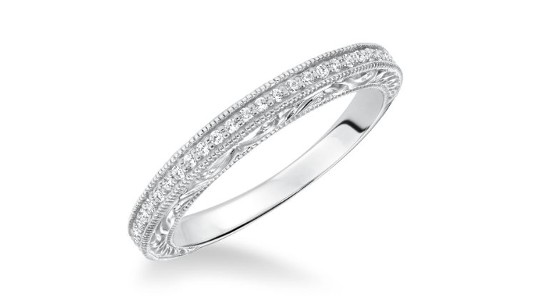 a white gold, vintage-inspired wedding band with diamond details